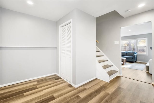 stairs with wood-type flooring