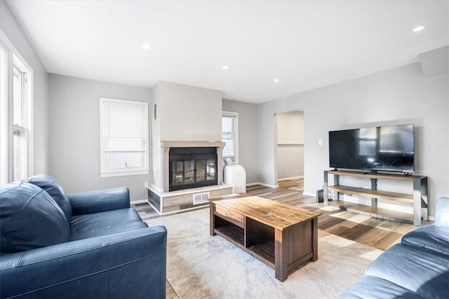 living room with light hardwood / wood-style floors