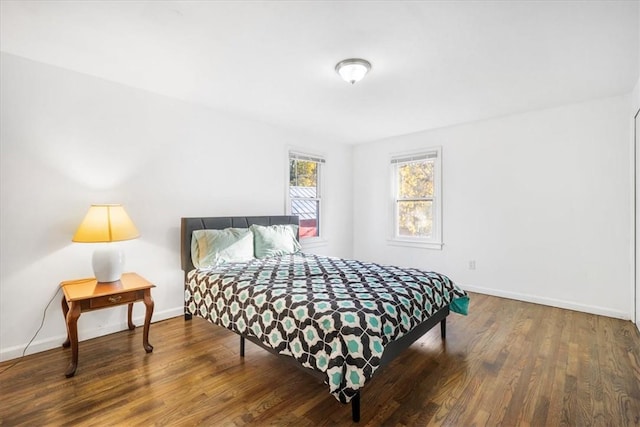 bedroom with hardwood / wood-style floors