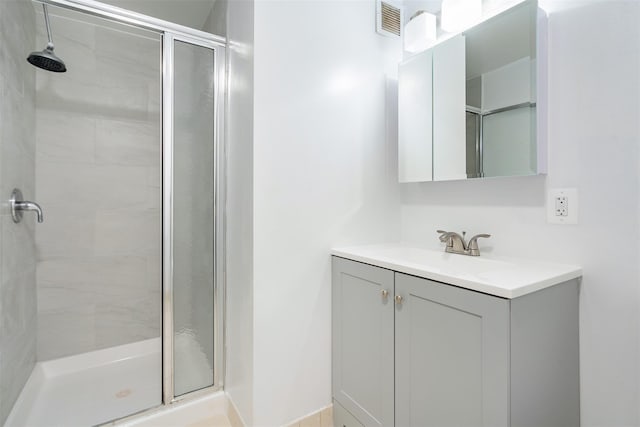 bathroom featuring vanity and walk in shower