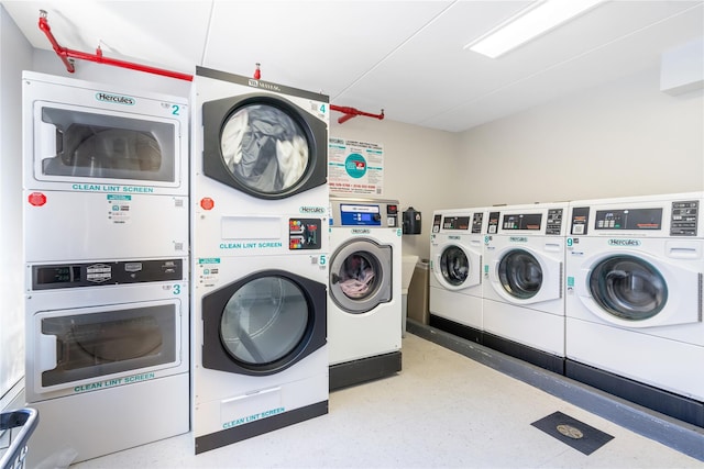 clothes washing area featuring stacked washer and clothes dryer and washing machine and clothes dryer