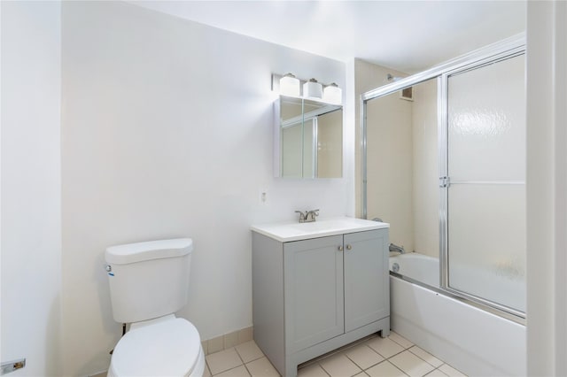 full bathroom featuring tile patterned flooring, vanity, bath / shower combo with glass door, and toilet