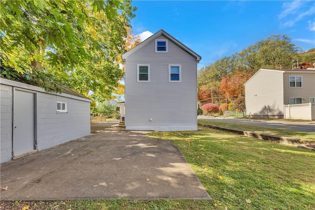 rear view of house with a lawn