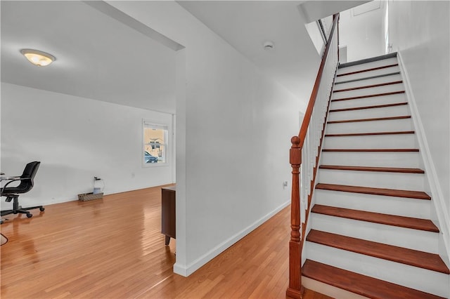 stairs with wood-type flooring