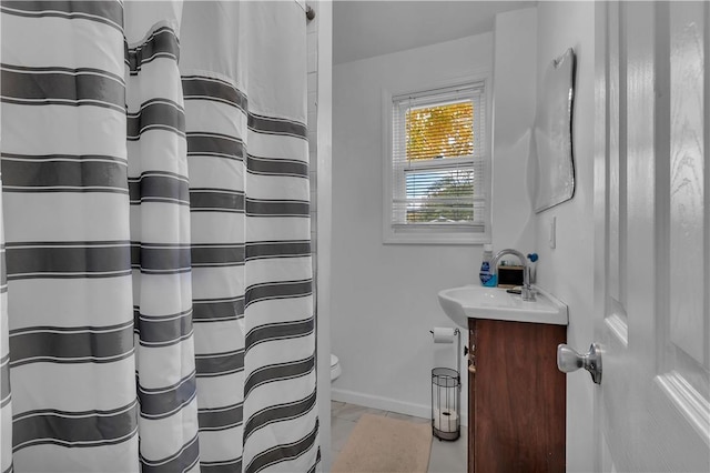 bathroom with vanity and toilet