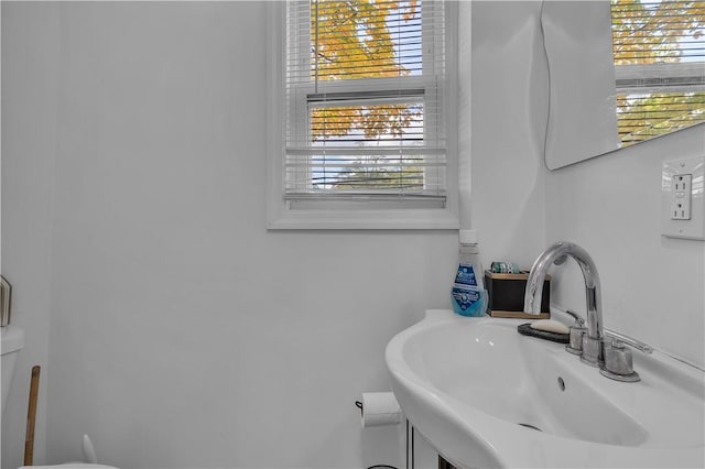 bathroom with toilet and sink