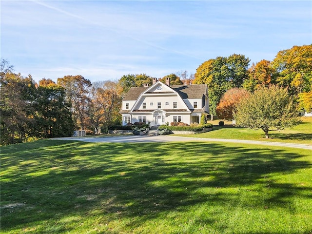 view of front of home with a front lawn