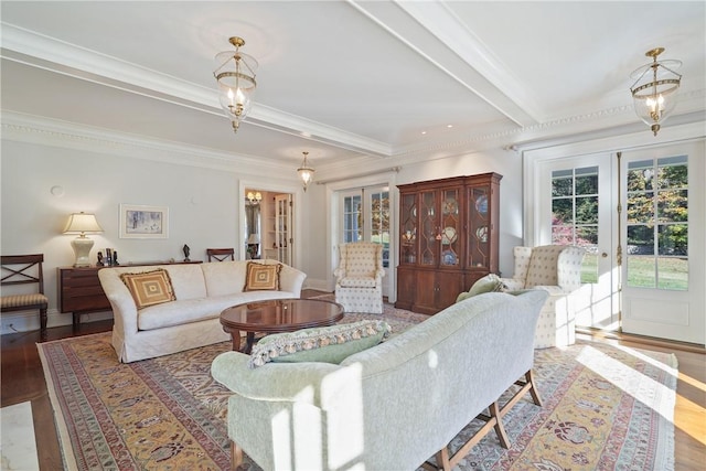 living room featuring beam ceiling, french doors, light hardwood / wood-style floors, and ornamental molding