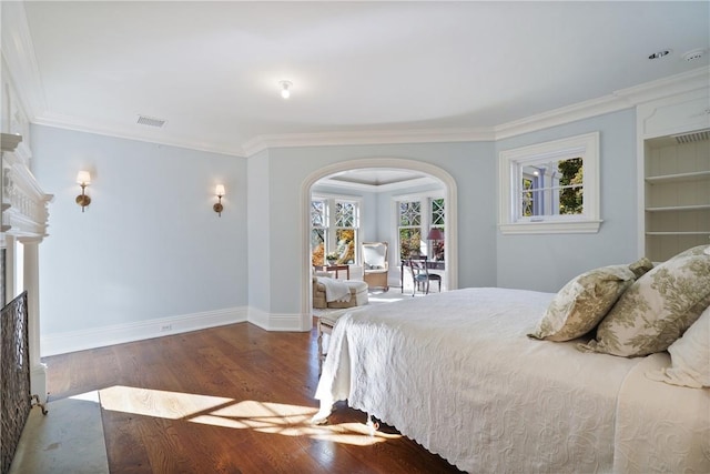 bedroom featuring wood-type flooring and ornamental molding