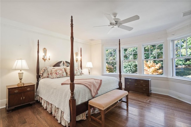 bedroom featuring multiple windows, ceiling fan, dark wood-type flooring, and ornamental molding