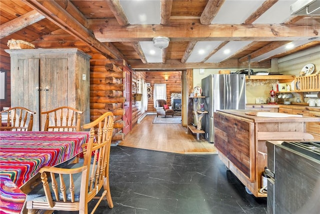 dining room featuring beam ceiling, rustic walls, dark hardwood / wood-style flooring, and wood ceiling