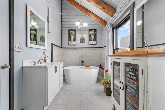 bathroom featuring wood ceiling, a washtub, vanity, a chandelier, and vaulted ceiling with beams