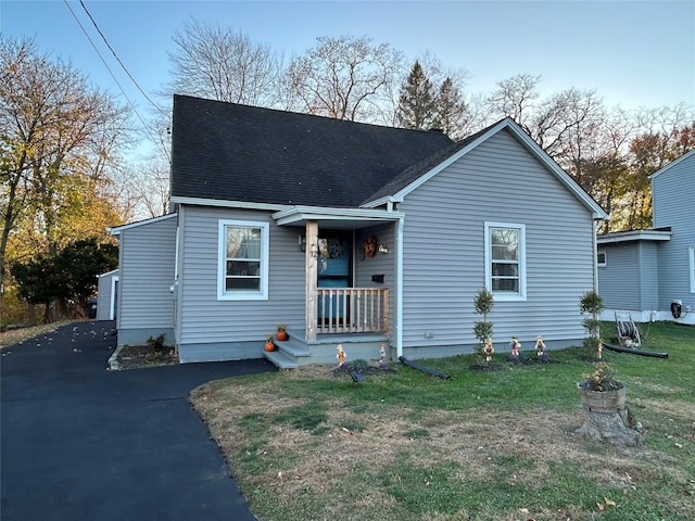 view of front of property with a garage and covered porch