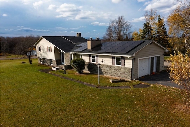 342 Reynolds Rd, Loch Sheldrake, NY 12759 - view of front of home featuring solar panels, a garage, and a front lawn