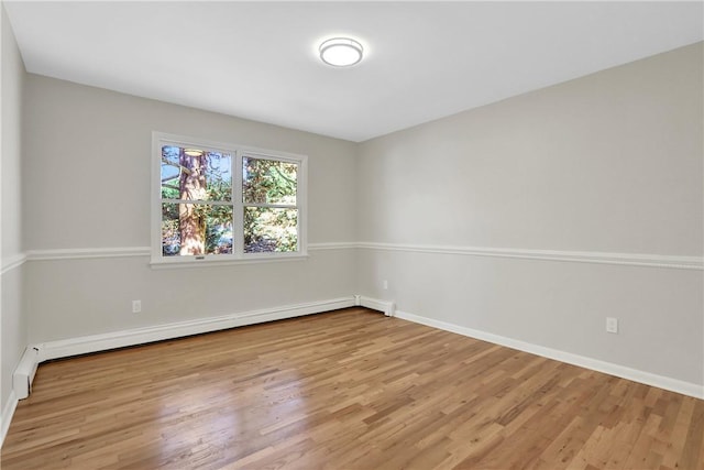 2 Requa St, Briarcliff Manor, NY 10510 - empty room featuring wood finished floors, baseboard heating, and baseboards