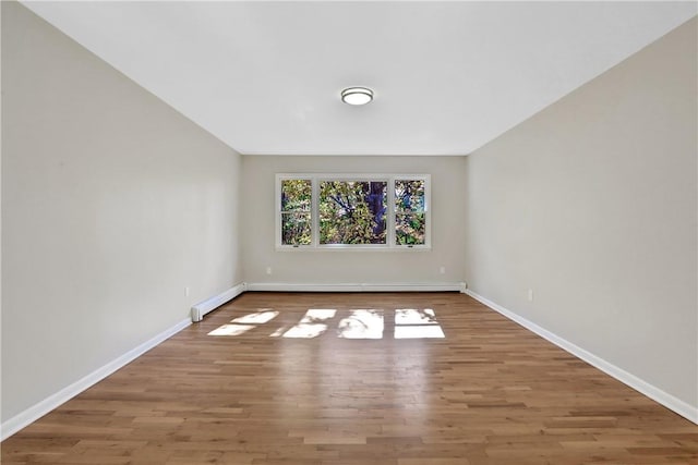 2 Requa St, Briarcliff Manor, NY 10510 - spare room with baseboards, wood finished floors, and a baseboard heating unit