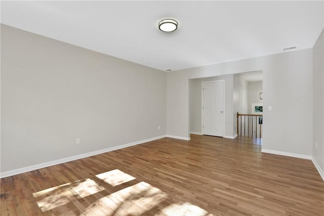 unfurnished room featuring hardwood / wood-style floors