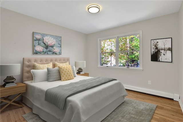 2 Requa St, Briarcliff Manor, NY 10510 - bedroom with a baseboard heating unit, wood finished floors, and baseboards
