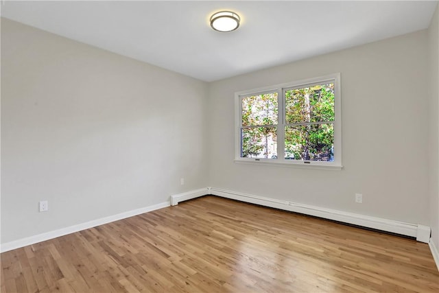 2 Requa St, Briarcliff Manor, NY 10510 - unfurnished room with wood finished floors, baseboards, and baseboard heating