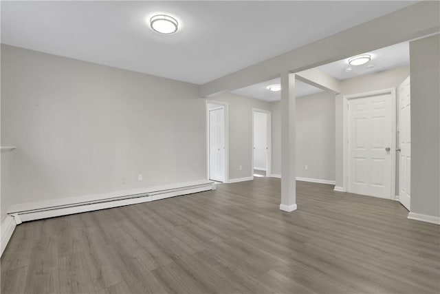 2 Requa St, Briarcliff Manor, NY 10510 - below grade area with baseboard heating, baseboards, and wood finished floors