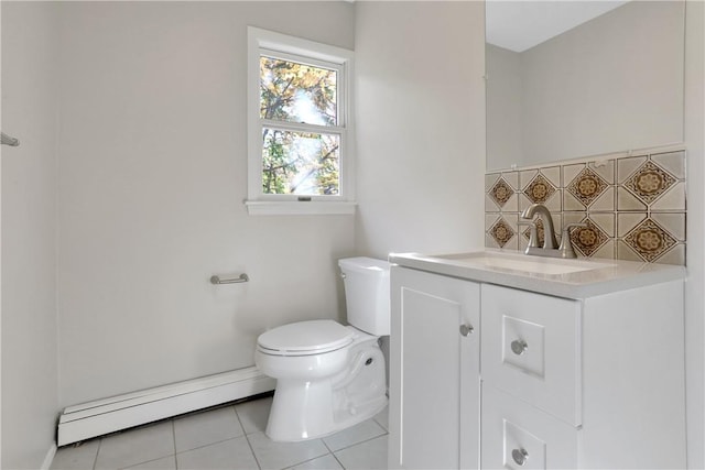 bathroom featuring vanity, tile patterned flooring, decorative backsplash, toilet, and baseboard heating