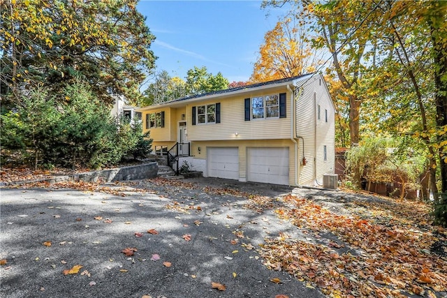 2 Requa St, Briarcliff Manor, NY 10510 - view of front of property with an attached garage and asphalt driveway