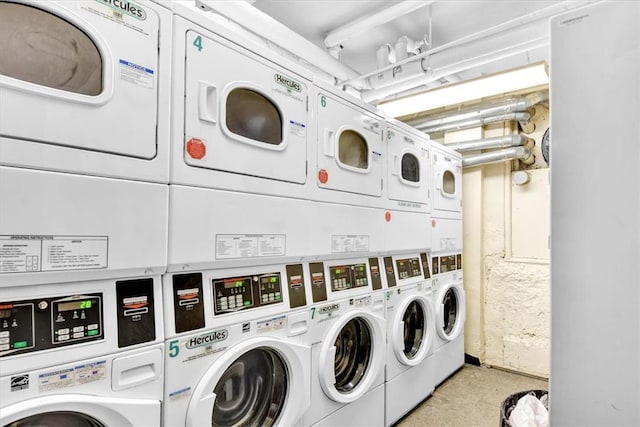 clothes washing area featuring stacked washer / dryer and washing machine and clothes dryer