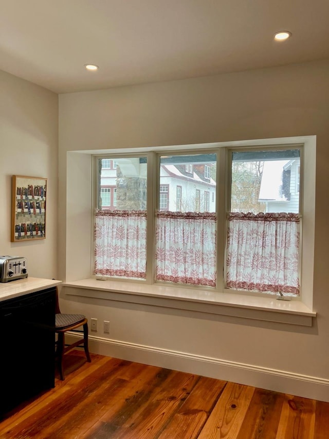 sitting room with hardwood / wood-style floors and plenty of natural light