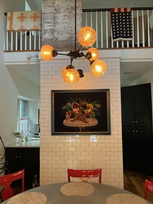 dining area featuring a high ceiling