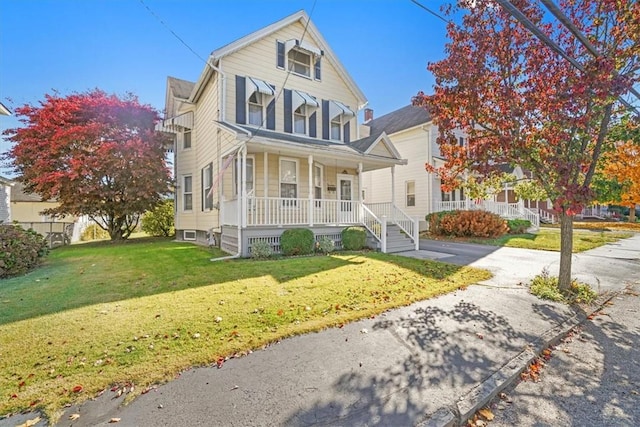 view of front facade featuring a porch and a front yard