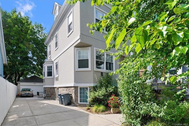 view of side of home with a garage