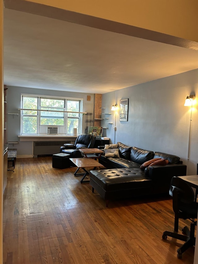 living room featuring hardwood / wood-style flooring and radiator