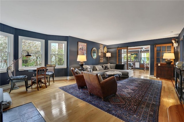 living room with light wood-type flooring and french doors