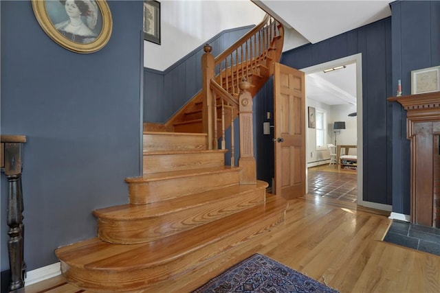 stairway featuring hardwood / wood-style floors