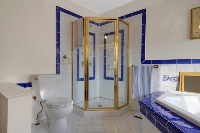 bathroom featuring an enclosed shower, tile patterned floors, and toilet