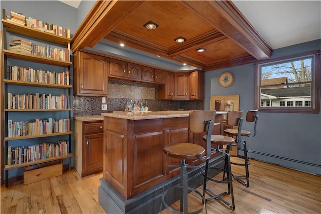 bar featuring decorative backsplash, light wood-type flooring, baseboard heating, and beam ceiling