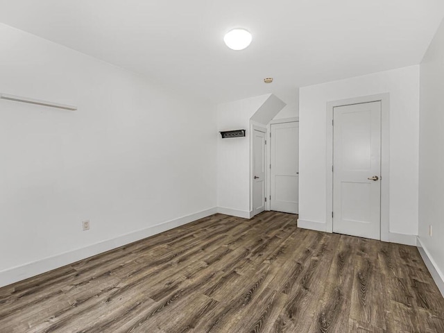 bonus room with dark hardwood / wood-style flooring