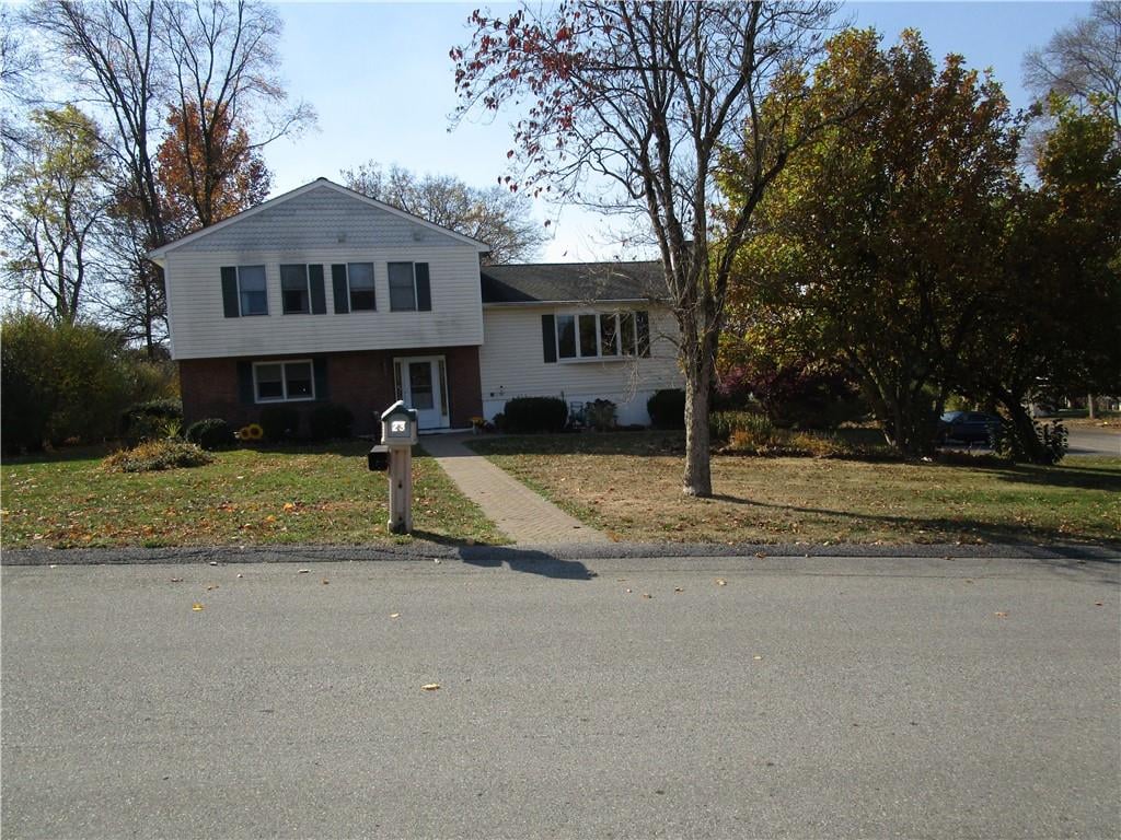 split level home with a front yard