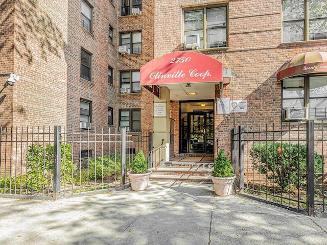 doorway to property featuring cooling unit