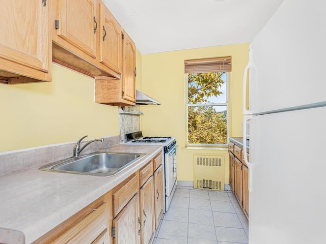 kitchen with radiator, sink, range hood, white appliances, and light tile patterned floors