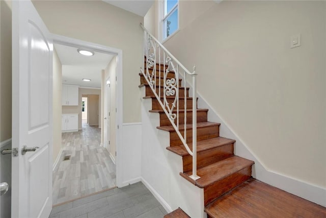 stairway with wood-type flooring