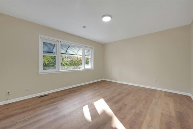 empty room with light wood-type flooring