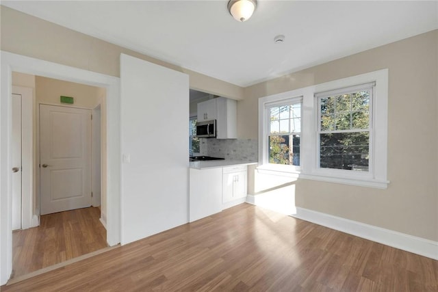 unfurnished living room featuring light hardwood / wood-style floors