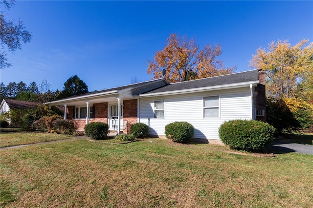 single story home featuring a front yard and a porch