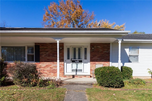 property entrance featuring a porch