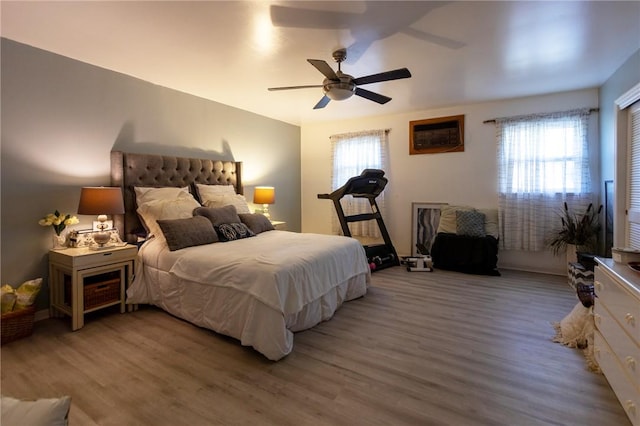 bedroom featuring ceiling fan and hardwood / wood-style flooring