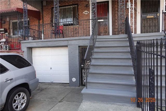 view of exterior entry featuring a garage