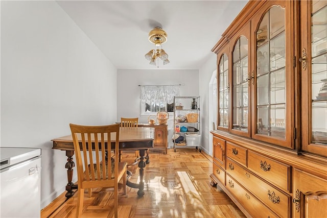 dining area featuring a wealth of natural light and light parquet floors