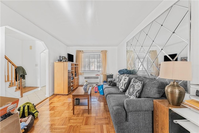 living room featuring radiator and parquet floors