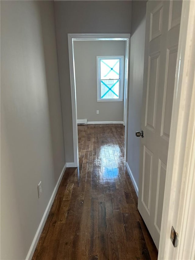 corridor featuring dark hardwood / wood-style flooring